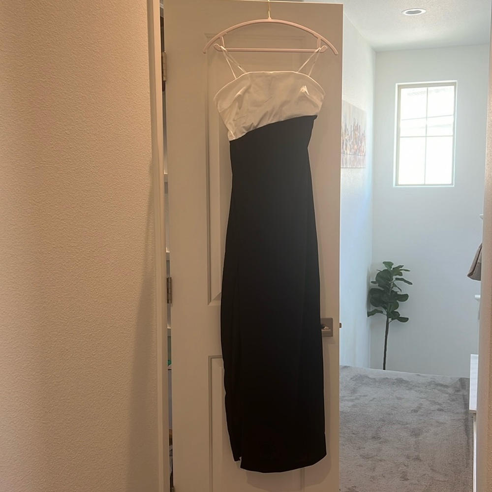 Black and white formal dress. Moderate Slit on the right